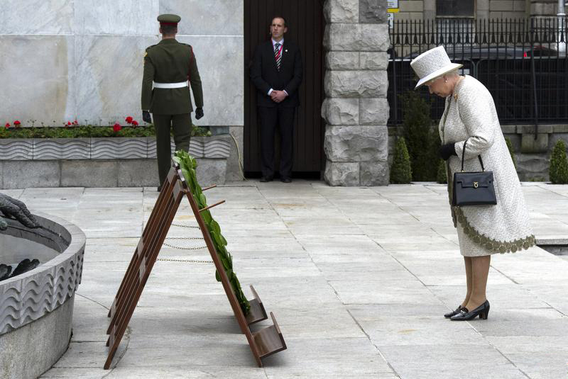 Queen Elizabeth II, the British head of state, bows her head to honour Ireland's Irish Republican revolutionaries, the Garden of Remembrance, Dublin, 2011