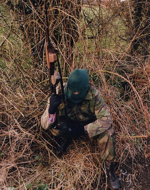 A Volunteer of the Irish Republican Army armed with an AKM assault rifle on patrol, British Occupied North of Ireland, 1994