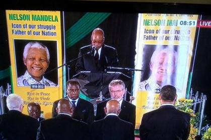 Specially invited by the ANC the president of Sinn Féin, Gerry Adams TD, is greeted with applause as he joins the Guard of Honour at the funeral of Nelson Mandela, the late president of South Africa, 2013