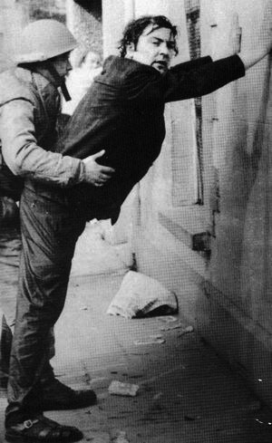 The Irish politician John Hume, later leader of the SDLP and winner of the Nobel Peace Prize, is detained by British soldiers in Derry and forced to assume the so-called "stress-position"