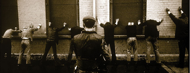 Irish civilians, men and teenagers, forced to assume the "stress-position" by watching British troops in Ireland during the 1970s