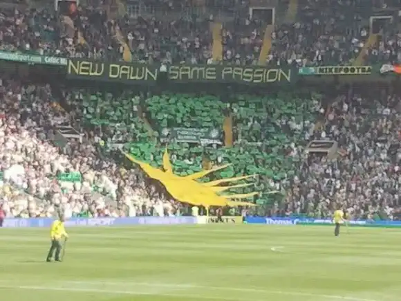 Celtic fans display a Fenian or Irish Sunburst at match, Glasgow, Scotland