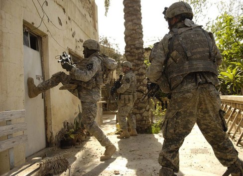 American soldiers prepare to storm a building in Iraq