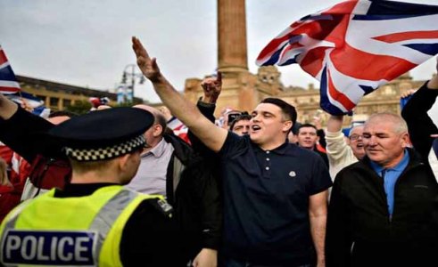 Anti-Scottish British unionist and nationalist extremists holding anti-independence signs while giving Nazi salutes