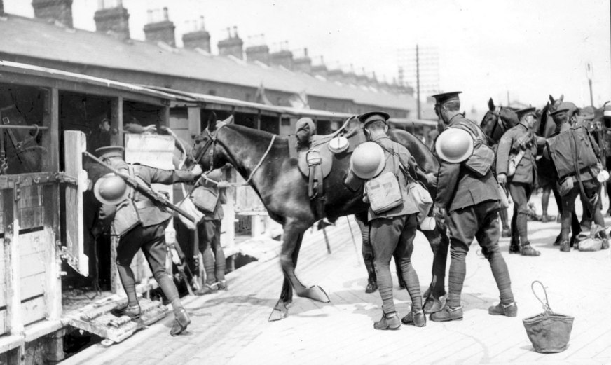 Gunners of the Royal Field Artillery load their horses onto a train bound for the Pettigo-Belleek salient, Ireland, 3rd June 1922