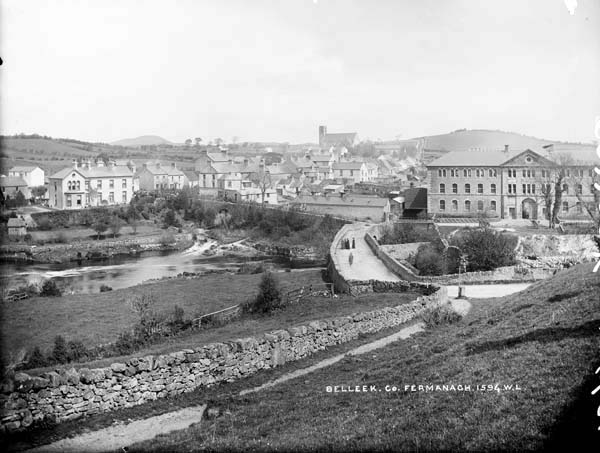 The town of Belleek, with the River Erne, crossed by a bridge, running across the middle of the image, c.1900