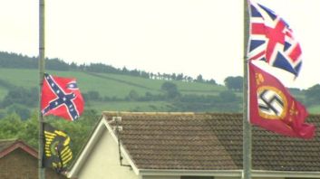 Confederate, Nazi and British terrorist banners erected by extreme unionists or UK separatists in Ireland fly over the town of Carrickfergus