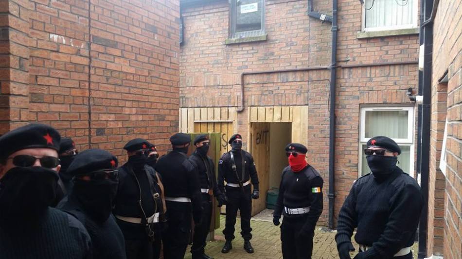 Volunteers of the Irish National Liberation Army or INLA gather for a military parade in Belfast, 2016
